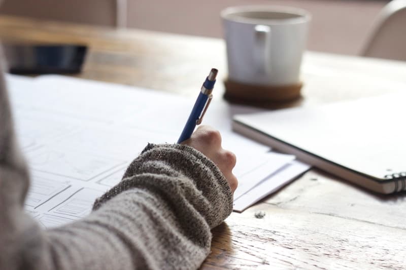 Open notebook and study materials on a desk