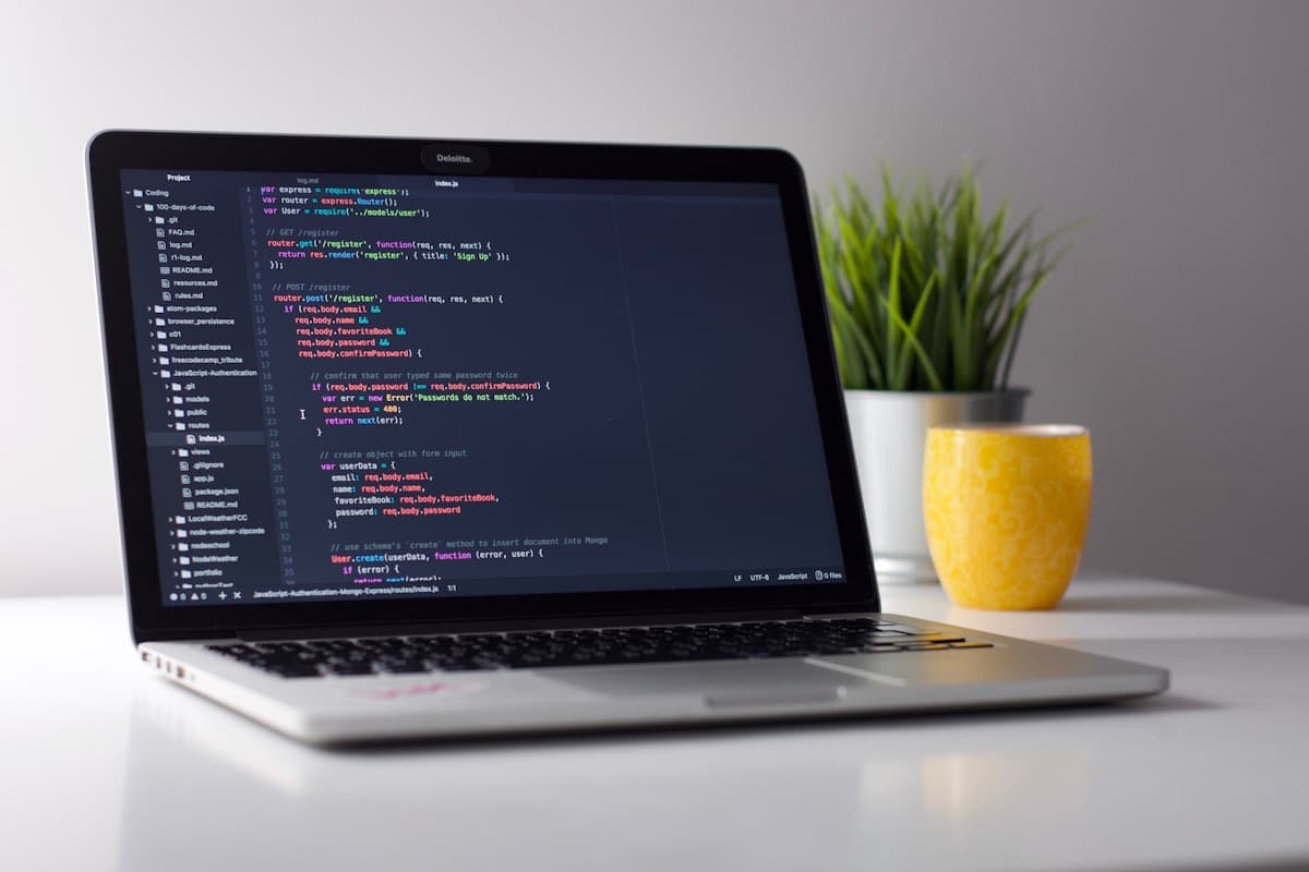Student coding on a laptop